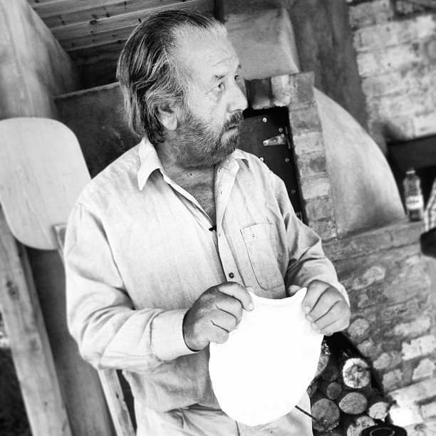 Pizza dough at the wood oven